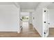 Hallway showing access to living spaces and a staircase at 467 Ravensworth Dr, Garner, NC 27529