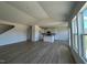 Open-concept living room and kitchen layout featuring hardwood floors, recessed lighting, and large windows at 467 Ravensworth Dr, Garner, NC 27529