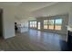 Bright living room with an open floor plan, fireplace, large windows and seamless flow to the kitchen at 467 Ravensworth Dr, Garner, NC 27529