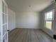 Office/flex room with hardwood floors, natural light and glass panel french doors at 467 Ravensworth Dr, Garner, NC 27529