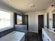A spacious bathroom features a tub, shower, and a double sink vanity at 505 Ravensworth Dr, Garner, NC 27529