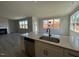 Open kitchen features quartz counters and stainless steel appliances, perfect for cooking at 505 Ravensworth Dr, Garner, NC 27529