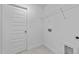 Laundry room with shelving and a door at 505 Ravensworth Dr, Garner, NC 27529