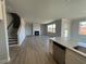 Open-concept living room showcasing fireplace, natural light, and modern flooring at 505 Ravensworth Dr, Garner, NC 27529