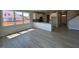 Living room with great natural light showcases modern flooring and access to kitchen at 505 Ravensworth Dr, Garner, NC 27529