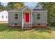 Gray house with red door, steps, and landscaping at 520 Avon Ave, Burlington, NC 27215