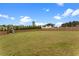 Large, fully fenced backyard with a shed, offering ample green space for outdoor activities at 58 Northview Dr, Middlesex, NC 27557