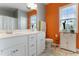 Bathroom featuring double sink vanity, white cabinets, and large mirror at 58 Northview Dr, Middlesex, NC 27557