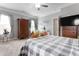 Inviting bedroom with neutral walls, lots of natural light and hardwood floors at 58 Northview Dr, Middlesex, NC 27557