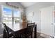 A bright dining room with a modern light fixture, a large table, and a backyard view at 58 Northview Dr, Middlesex, NC 27557