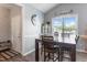 Dining room with modern light fixture, a dark wooden table and four chairs at 58 Northview Dr, Middlesex, NC 27557
