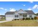 Charming single-story home featuring a well-manicured lawn, attached garage, and inviting front porch at 58 Northview Dr, Middlesex, NC 27557