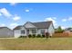 Beautiful single-story home with well-maintained landscaping, a two-car garage, and a covered front porch at 58 Northview Dr, Middlesex, NC 27557