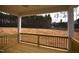 A view of a new wooden deck with a spacious view of the wooded backyard at 60 Accord Dr, Youngsville, NC 27596