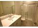 Bathroom featuring a sink and vanity and a shower with glass doors at 60 Accord Dr, Youngsville, NC 27596