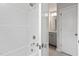 Bathroom showcasing a shower-tub combo with chrome fixtures and a view of the vanity area at 60 Accord Dr, Youngsville, NC 27596