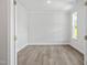 Empty room with wood floors, white walls, and a window at 60 Accord Dr, Youngsville, NC 27596