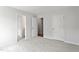 A bright bedroom with neutral carpet and doors leading to the bathroom and closet at 60 Accord Dr, Youngsville, NC 27596