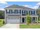 Charming two-story home with a two-car garage and inviting front porch at 60 Accord Dr, Youngsville, NC 27596
