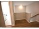 Hallway with hardwood floors leading to the bathroom at 60 Accord Dr, Youngsville, NC 27596