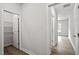 Hallway leading to rooms with wood floors and access to a pantry at 60 Accord Dr, Youngsville, NC 27596