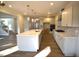 Spacious kitchen featuring stainless steel appliances, center island, and hardwood floors at 60 Accord Dr, Youngsville, NC 27596