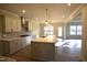 Gourmet kitchen and dining area with large island, modern lighting, and hardwood floors at 60 Accord Dr, Youngsville, NC 27596