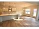Open concept kitchen and dining area featuring hardwood floors and stainless steel appliances at 60 Accord Dr, Youngsville, NC 27596