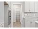 Close-up of a kitchen featuring stainless steel appliances and white cabinetry at 60 Accord Dr, Youngsville, NC 27596
