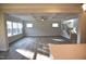 Bright living room featuring hardwood floors, coffered ceiling, and staircase access at 60 Accord Dr, Youngsville, NC 27596