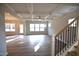 Bright living room featuring hardwood floors, coffered ceilings, and large windows at 60 Accord Dr, Youngsville, NC 27596