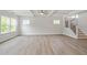 Spacious living room with wood floors, recessed lighting, ceiling fan, and natural light at 60 Accord Dr, Youngsville, NC 27596