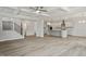 Spacious living room adjacent to a kitchen, featuring high ceilings and wood flooring at 60 Accord Dr, Youngsville, NC 27596