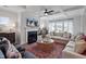 Bright living room with fireplace, large windows, and stylish decor creating an inviting atmosphere at 60 Accord Dr, Youngsville, NC 27596