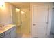 Modern main bathroom featuring glass walk-in shower and a double vanity at 60 Accord Dr, Youngsville, NC 27596