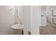 Powder room with pedestal sink and a mirror at 60 Accord Dr, Youngsville, NC 27596