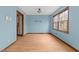 Simple dining room with hardwood floors and large window at 6708 Winding Trl, Raleigh, NC 27612