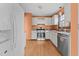 Kitchen with light cabinets, granite countertops and stainless steel appliances at 6708 Winding Trl, Raleigh, NC 27612