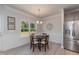 Breakfast nook with wood table and chairs, adjacent to kitchen at 68 Streamline Ct, Lillington, NC 27546