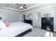 Comfortable main bedroom with carpet, tray ceiling, and stylish black furniture at 68 Streamline Ct, Lillington, NC 27546