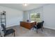 Functional office space featuring a large desk, comfortable chairs, and natural light from the window at 68 Streamline Ct, Lillington, NC 27546