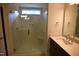 Modern bathroom featuring a glass shower with tile surround and a vanity with granite countertop at 70 Accord Dr, Youngsville, NC 27596