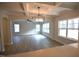 Living room with coffered ceilings, hardwood floors, recessed lighting, and an open view of the kitchen at 70 Accord Dr, Youngsville, NC 27596