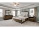 Spacious main bedroom with tray ceiling, neutral decor, and ample natural light at 70 Accord Dr, Youngsville, NC 27596
