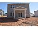 View of the home's backyard and covered porch at 75 Calabria Ct, Franklinton, NC 27525