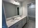 Bathroom featuring double sink vanity and large mirror, adjacent to a shower at 75 Calabria Ct, Franklinton, NC 27525