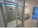 Modern bathroom featuring tiled walk-in shower with glass door and vanity with sink at 75 Calabria Ct, Franklinton, NC 27525