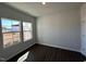 Bedroom featuring dark wood floors and large windows with sunny exterior view at 75 Calabria Ct, Franklinton, NC 27525