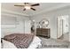Bright bedroom featuring neutral walls, carpet floors, and a wooden dresser at 75 Calabria Ct, Franklinton, NC 27525