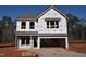 Two-story house with gray shingle roof, vinyl siding, and two-car garage at 75 Calabria Ct, Franklinton, NC 27525